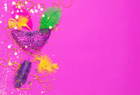 Carnival mask colored feathers traditional sequin beads for Mardi Gras festival purple backgroundの写真素材