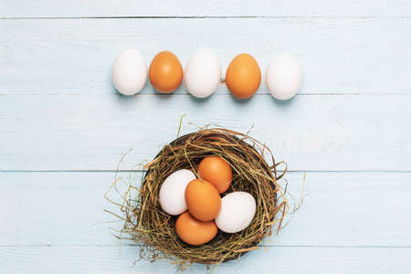 Festive composition Easter eggs nest pastel wooden background Festive flat lay concept Happy Easter