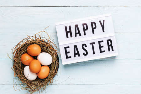Festive composition Easter eggs board with Phrase Happy Easter pastel background concept Easter