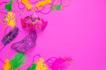 Carnival mask with colored feathers traditional sequin beads Mardi Gras festival purple backgroundの写真素材