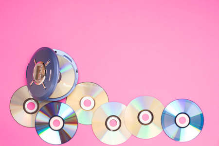 Personal compact portable CD player discs bright pink background. Top viewの写真素材