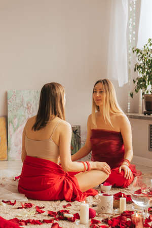 A female reiki master works with patient. Womens circle, concept of mental health, harmony of bodyの写真素材