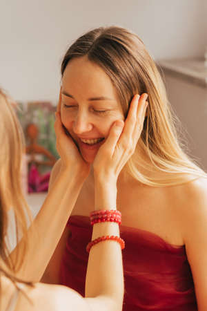 A female reiki master works with patient. Womens circle, concept of mental health, harmony of bodyの写真素材