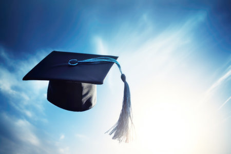 Graduation cap thrown into the blue sky. Graduation from an educational institution, school, university, college, tradition,の素材