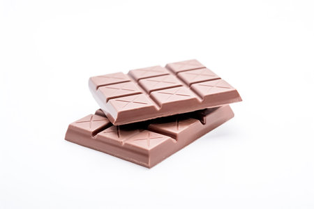 Milk chocolate bar, white background, copy space. Sweet chocolate dessert, top view. AI generatedの素材