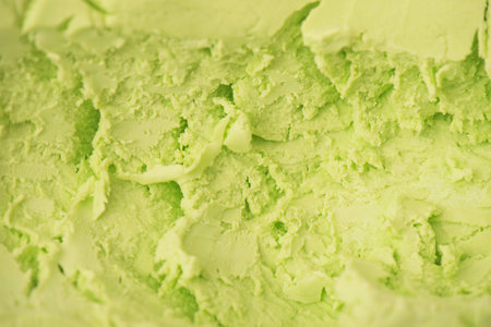 Pistachio or lime ice cream, texture. Delicious ice cream texture background. Summer cooling dessertsの写真素材