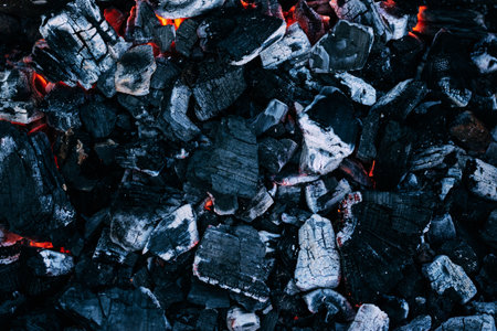 Background of burning hot coals. Burning coals in the brazier, barbecue grillの写真素材