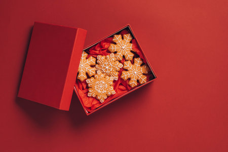 Christmas gingerbread cookies red background. Winter treat gingerbread. Christmas New Year conceptの写真素材