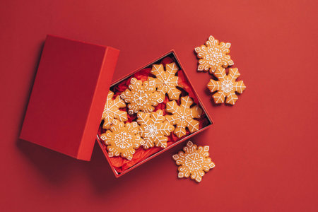 Christmas gingerbread cookies red background. Winter treat gingerbread. Christmas New Year conceptの写真素材