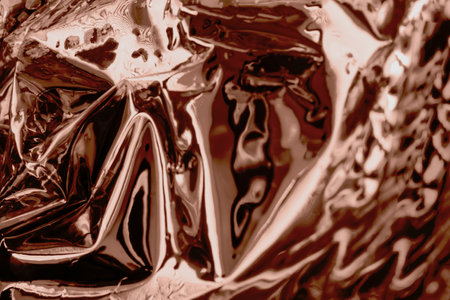 Abstract chocolate swirl with metallic reflections and rich texturesの写真素材