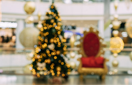 Blurred christmas tree and chair in shopping mall. Festive Christmas Blurred Background, Templateの写真素材