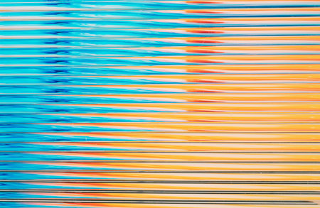 Abstract horizontal lines creating blue orange texture backgroundの写真素材