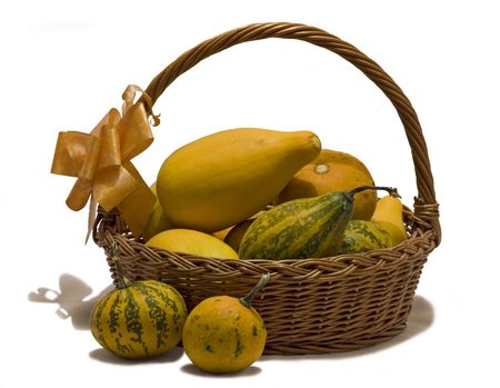 Still life with handmade basket full of pumpkinsの写真素材