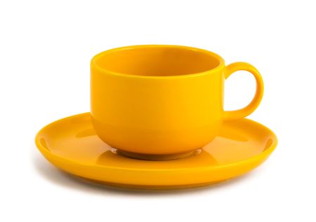 Simple yellow coffee cup and saucer on white backgroundの写真素材