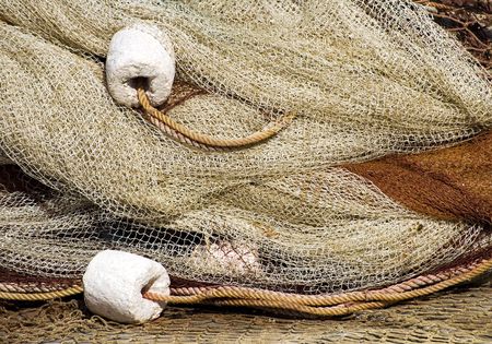 Traditional fishing net drying in the sunの写真素材
