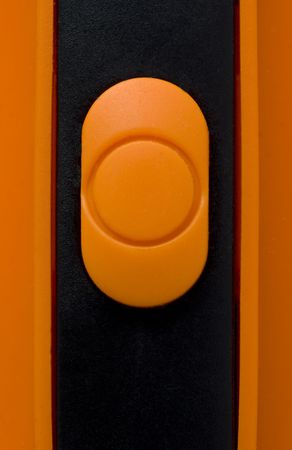 Orange plastic button close upの写真素材