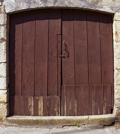 Old wooden door with fading paintの写真素材