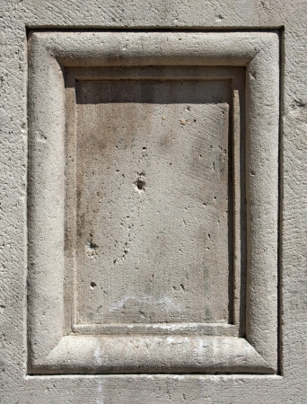 Blank panel chiseled in light grey stoneの写真素材