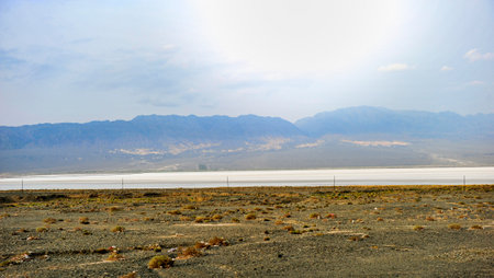 The boundless natural scenery of the Gobi Desert in Xinjiang, China, captured from a moving carの写真素材