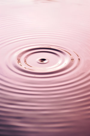 Water drop with ripples and ripples. Abstract background for designの素材