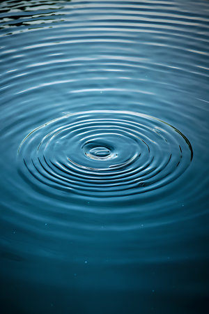 Water ripples on blue water surface. Abstract background for design.の素材