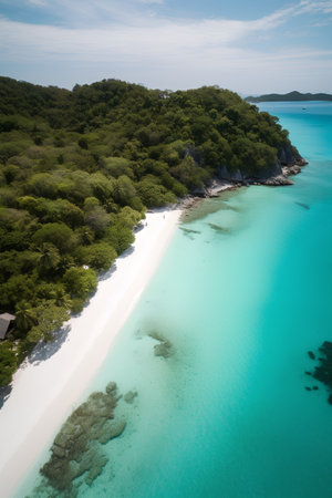Aerial view of beautiful tropical beach with white sand, turquoise ocean and blue skyの素材
