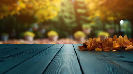 Wooden table with autumn leaves and blurred background. Collage.の素材
