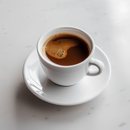 Cup of coffee on white marble table, top view, square cropの素材