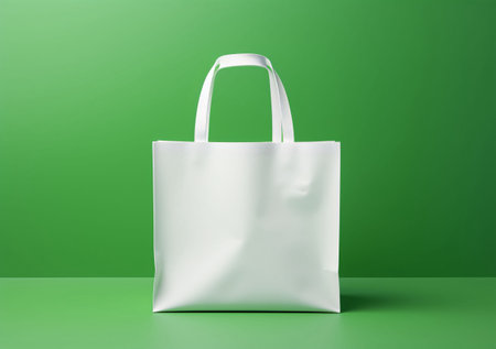 White canvas bag mockup on green background. 3d rendering.の素材