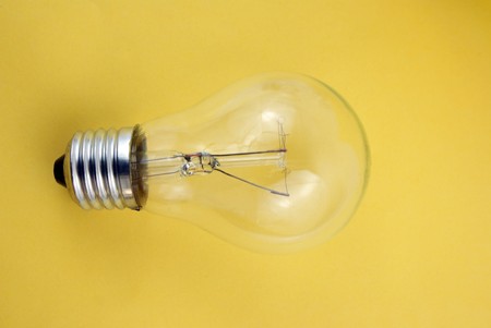   A close up on a light bulb on yellow