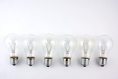 bulb in arrange in a row on white backgroundの写真素材