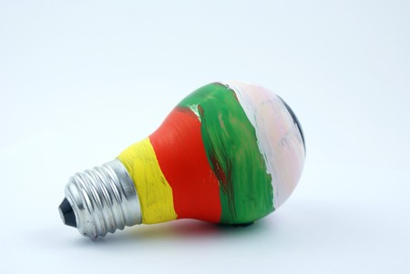 colorful lightbulb isolated on white background closeupの写真素材