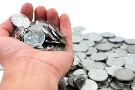 Holding coin background of A pile of coinsの写真素材