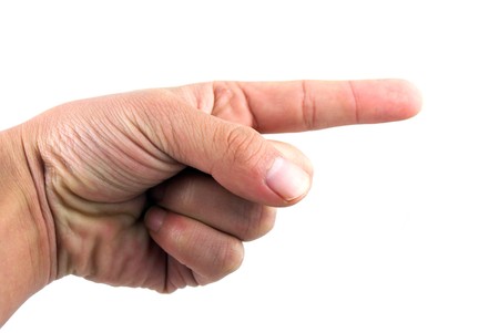 A hand of a businessman doing a pointing gesture, isolated on white background. の写真素材