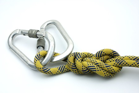 Single Figure 8 on a Bight tied on a yellow rope and master lockの写真素材
