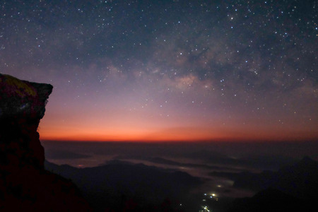 Landscape of Milky way mountain and deep forest at night sky, Pha Tang, ChiengRai province, Thailandの写真素材