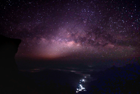 Landscape of Milky way mountain and deep forest at night sky, Pha Tang, ChiengRai province, Thailandの写真素材