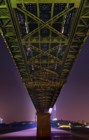 Night time at double deck bridge at Wuhan Yangtze River Bridge. Itâs famous for travel. Many people come to relax at evening time. In this area have park for relax.の写真素材