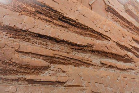 Wall with the rough texture and brown and red color rustic brick wall texture background.の写真素材
