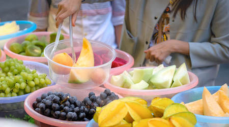 WUHAN CHINA-September 8 , 2018: Itâs one one of the vendor in local street food.  Hubuxiang snack street, They sell a lot of fruit at this street.のeditorial素材