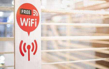 Free wifi sign in front of the entrance public area for people use  the high speed internet and for...