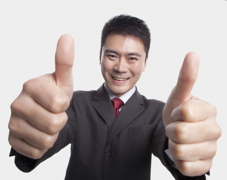 Businessman Giving Thumbs-Upの写真素材