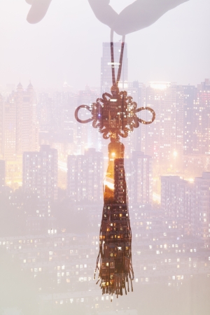 Holding Chinese Knot, Night City Viewの写真素材