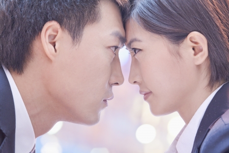 Two Business People Standing Face to Faceの写真素材