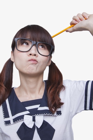 Portrait of School Girl Thinkingの写真素材