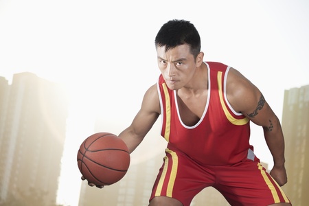 Basketball player, cityscape backgroundの写真素材