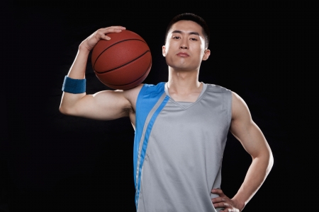 Portrait of basketball player, black backgroundの写真素材