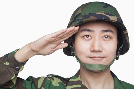 Man in military uniform salutingの写真素材