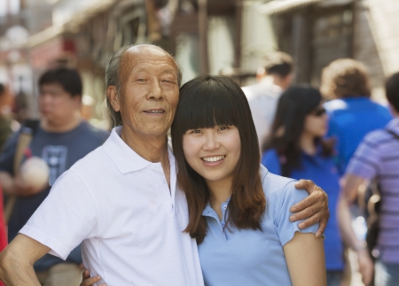 Portrait of grandfather and granddaughter together, outdoors in Beijingの写真素材