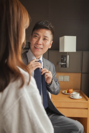 Business couple in hotel room の写真素材